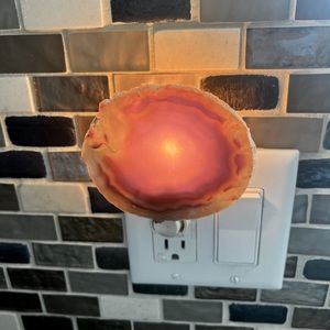 Adjustable night light made from a real stone. Click on with a button.
